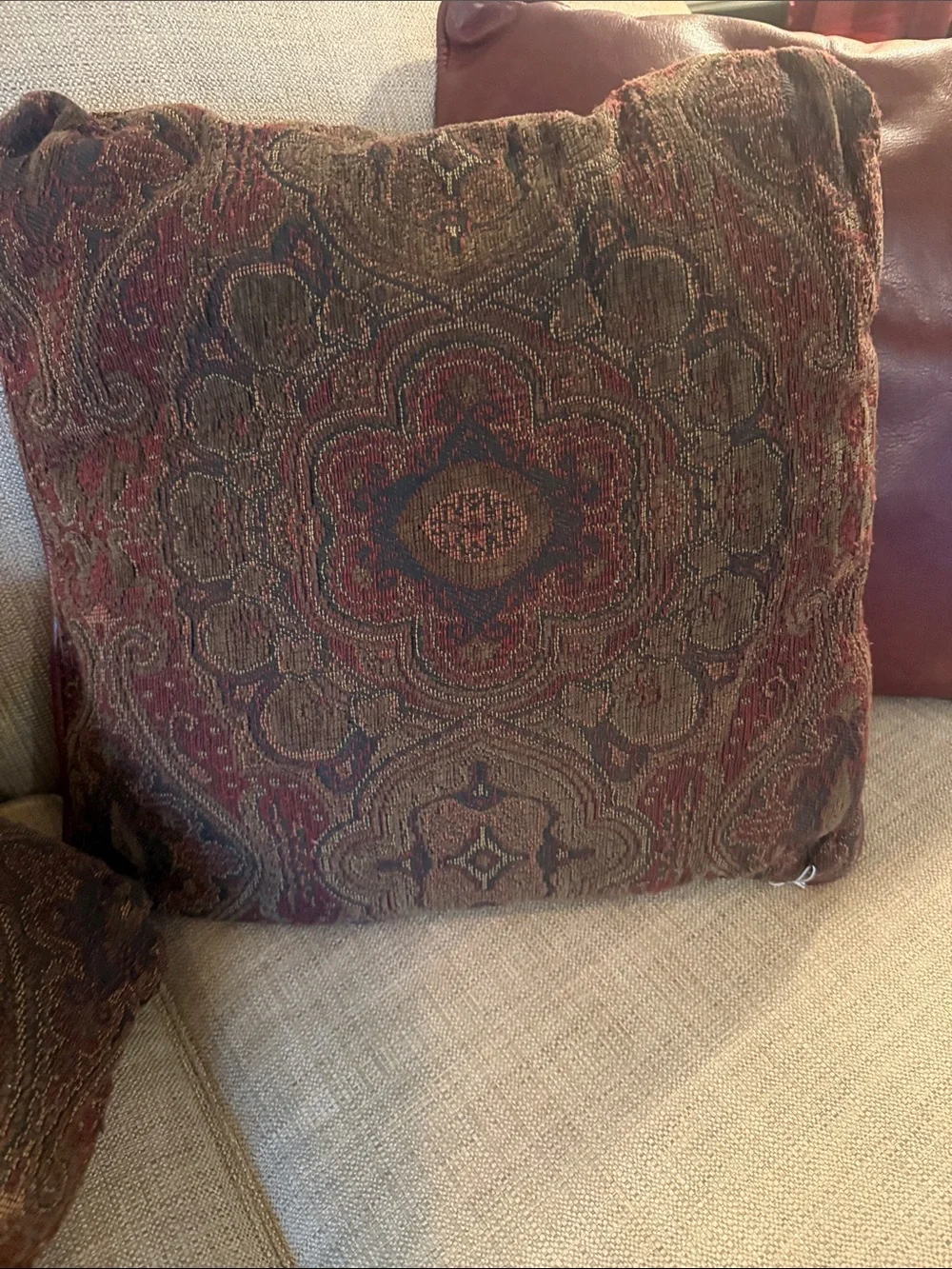 Ralph inspired leather backed with a brown/navy/0live green pillows. Set of 4